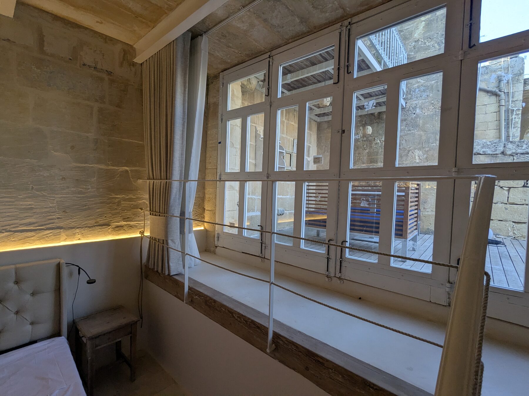 Bedroom window seat opening onto the inner courtyard